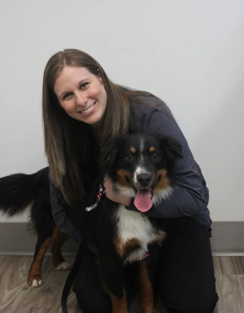 Megan New Haven Pet Hospital with a tan dog